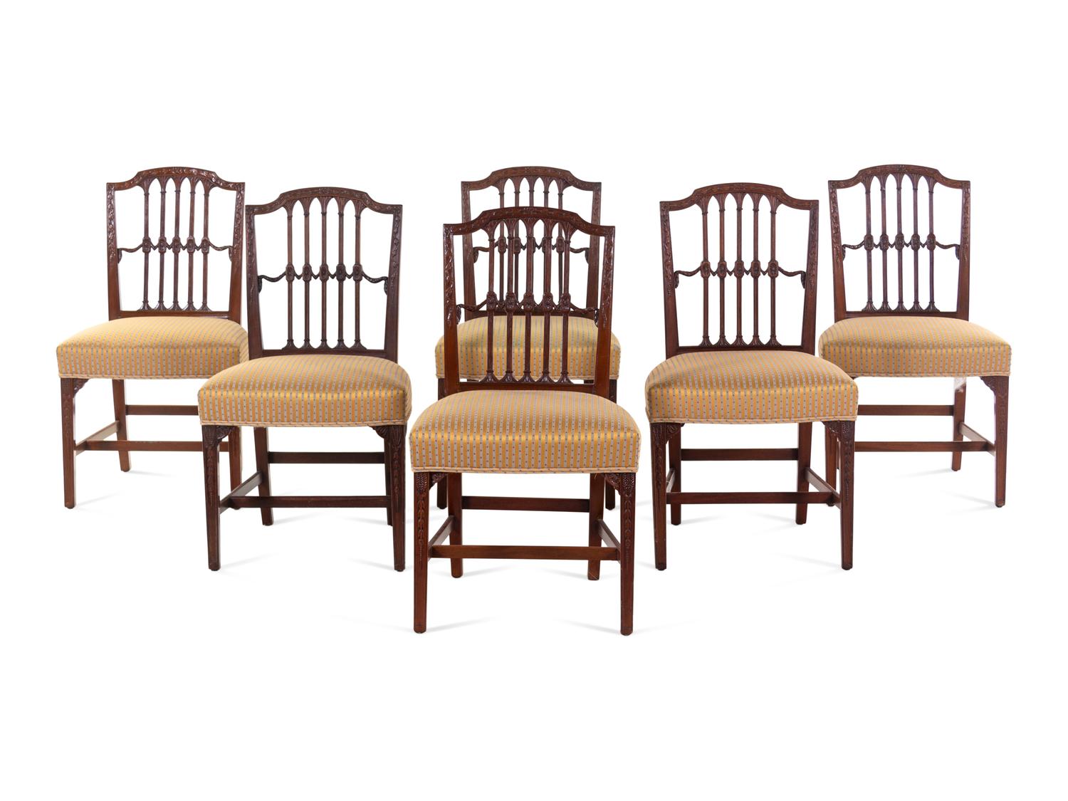A Set of Six Regency Carved Mahogany Dining Chairs