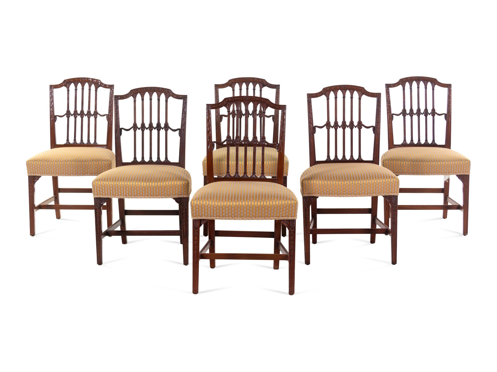 A Set of Six Regency Carved Mahogany Dining Chairs