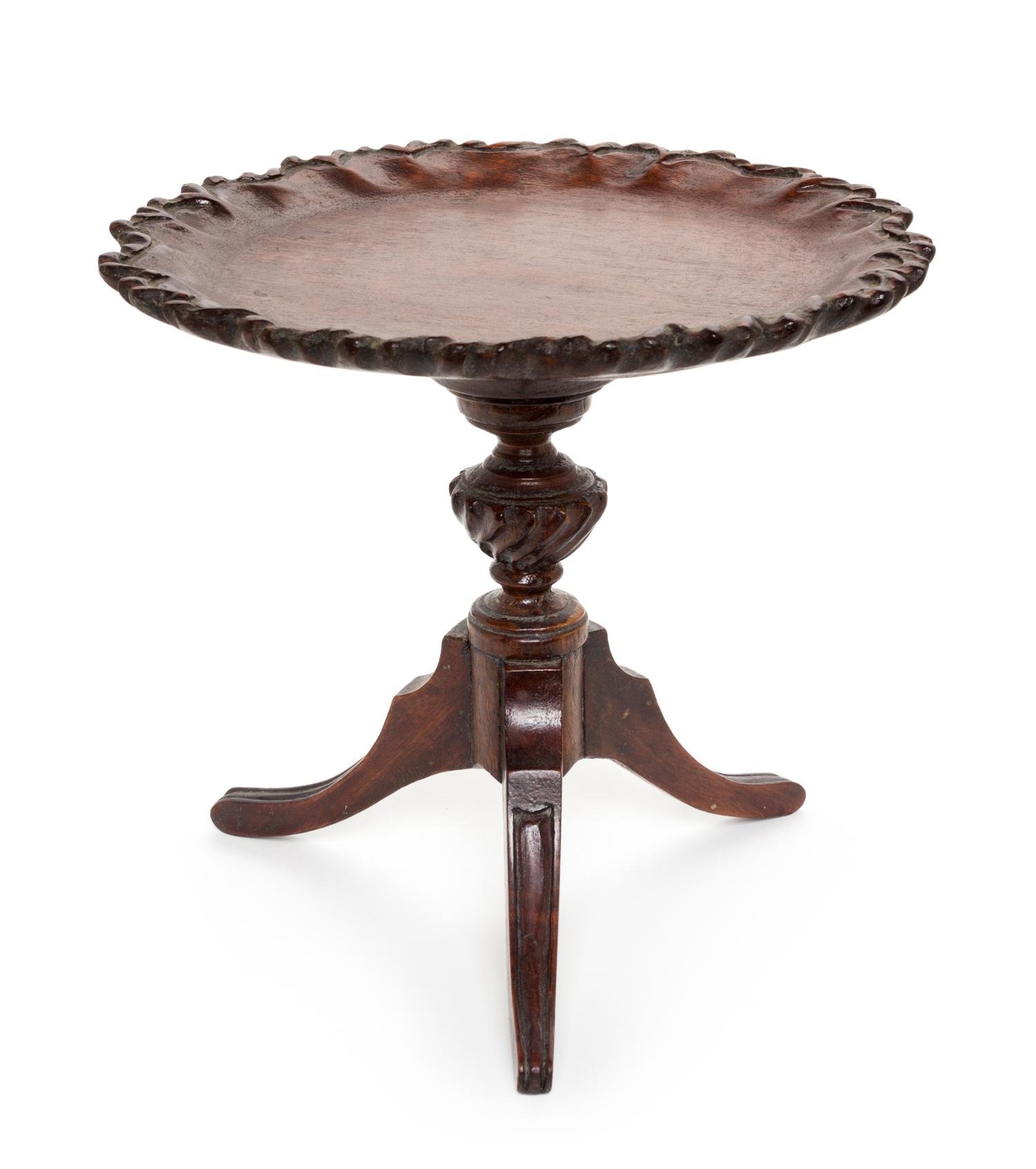 A Chippendale Style Mahogany Salesman's Model of a Tea Table Height 8 1/4 x diameter 8 3/4 inches. — 18TH/19TH CENTURY