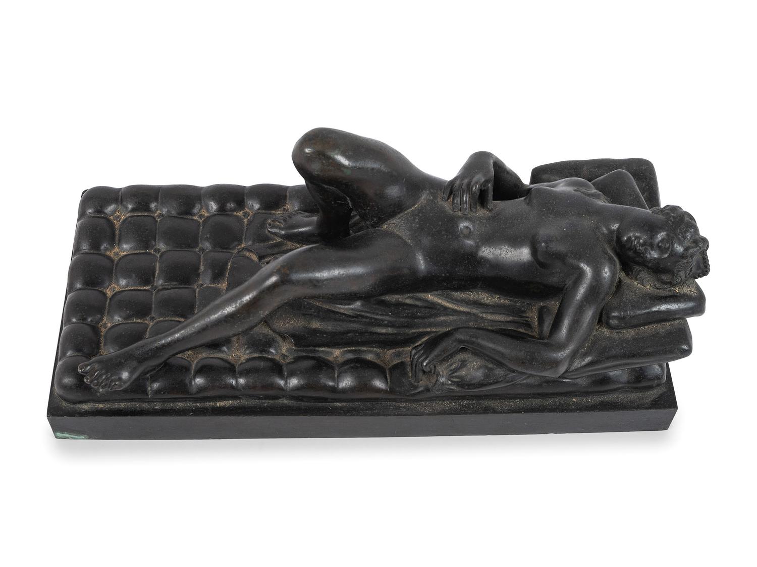 A Cast Bronze Figure of a Reclining Nude Woman