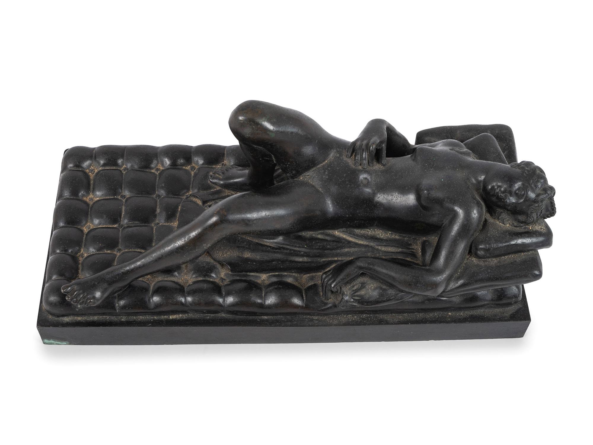 A Cast Bronze Figure of a Reclining Nude Woman