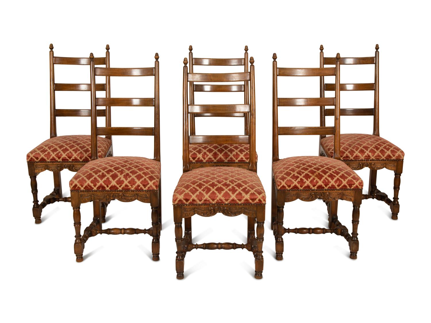 A Set of Six French Provincial Carved Walnut Dining Chairs