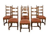 A Set of Six French Provincial Carved Walnut Dining Chairs