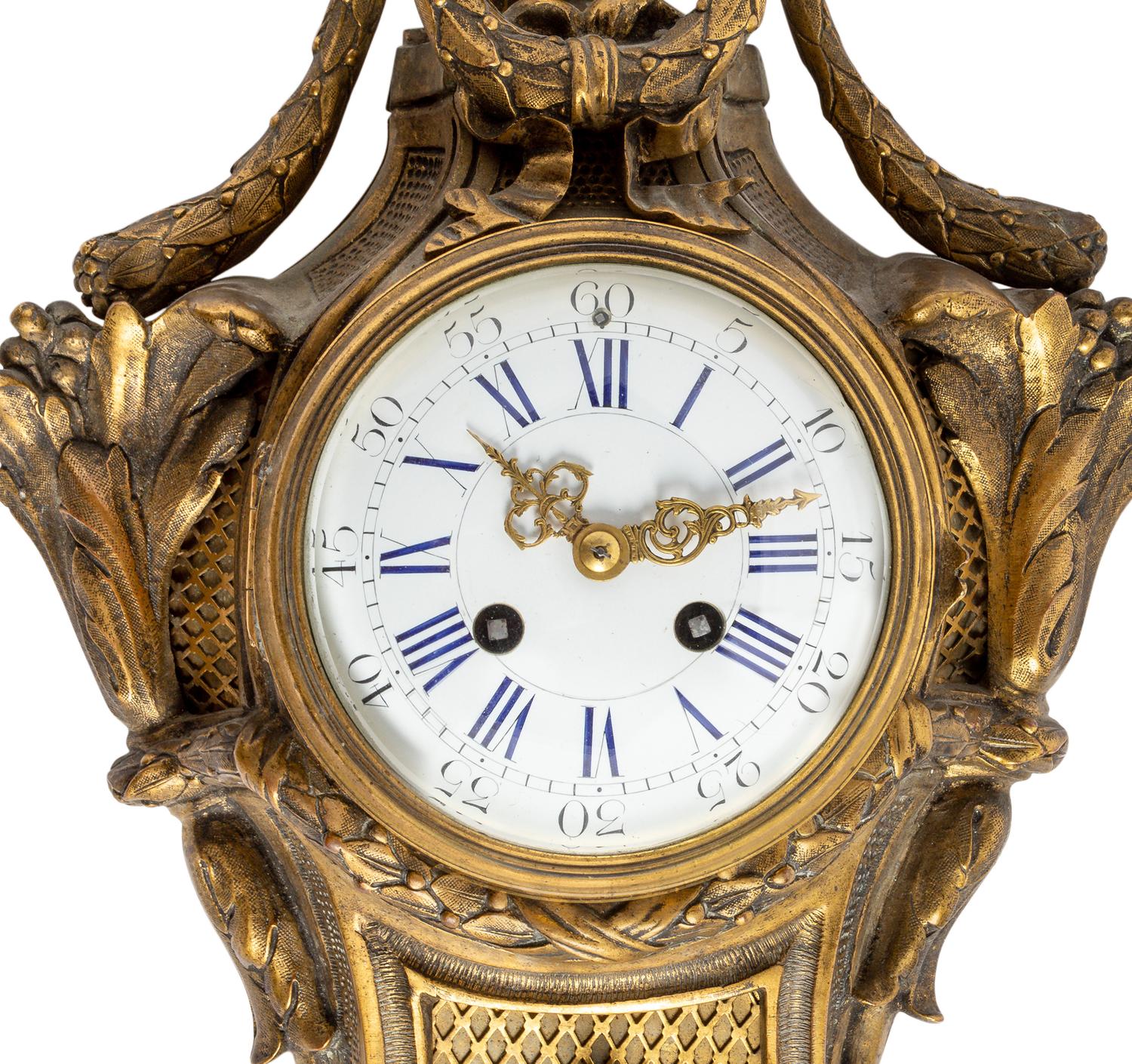 A Louis XVI Style Gilt Bronze Cartel Clock