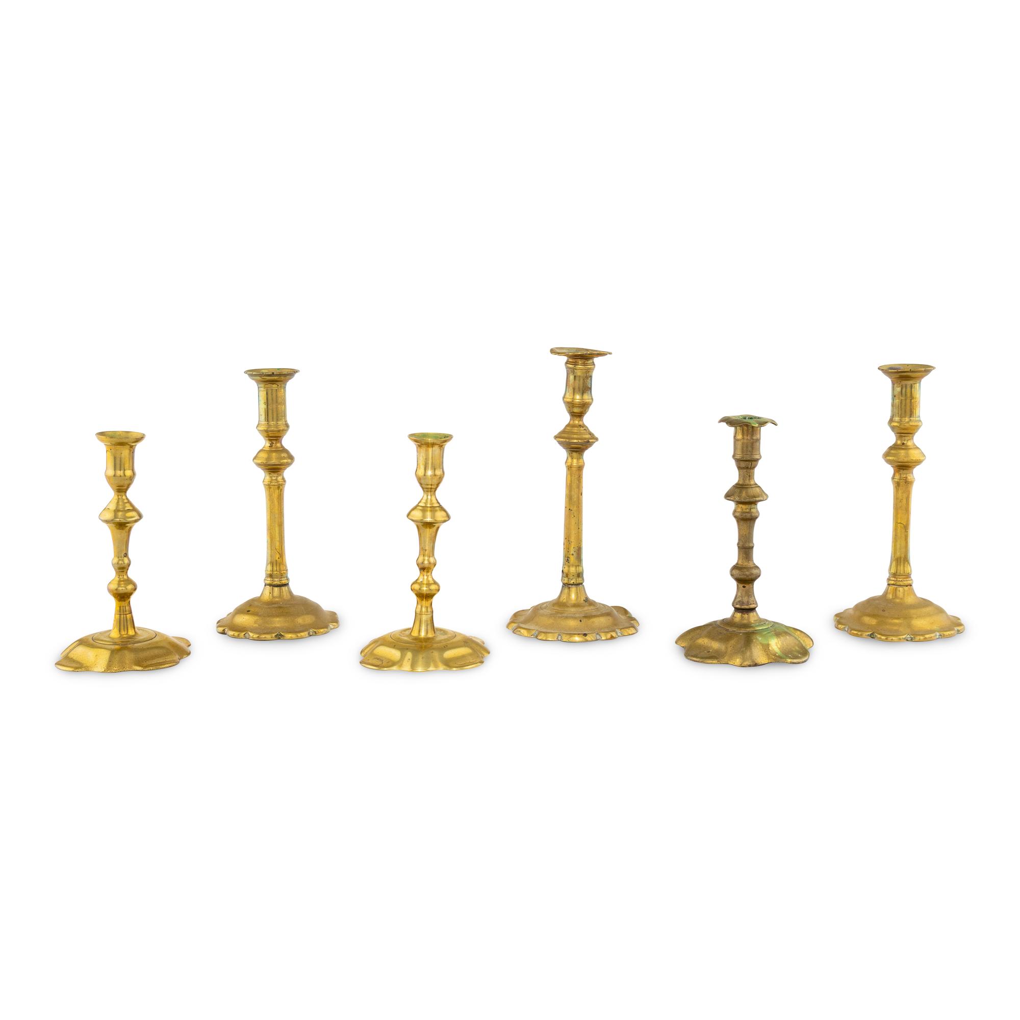 A Collection of Six Brass Candlesticks