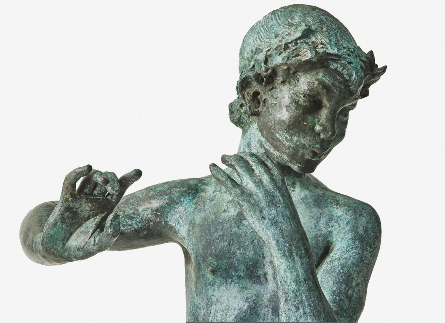 A bronze garden statue of Pan