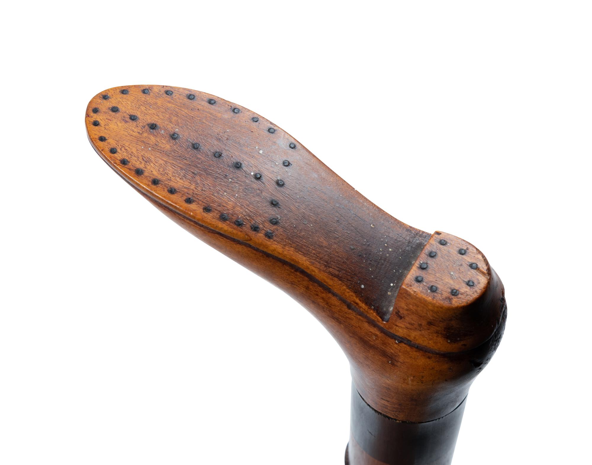 Two English Carved Wood Shoe-Form Canes
