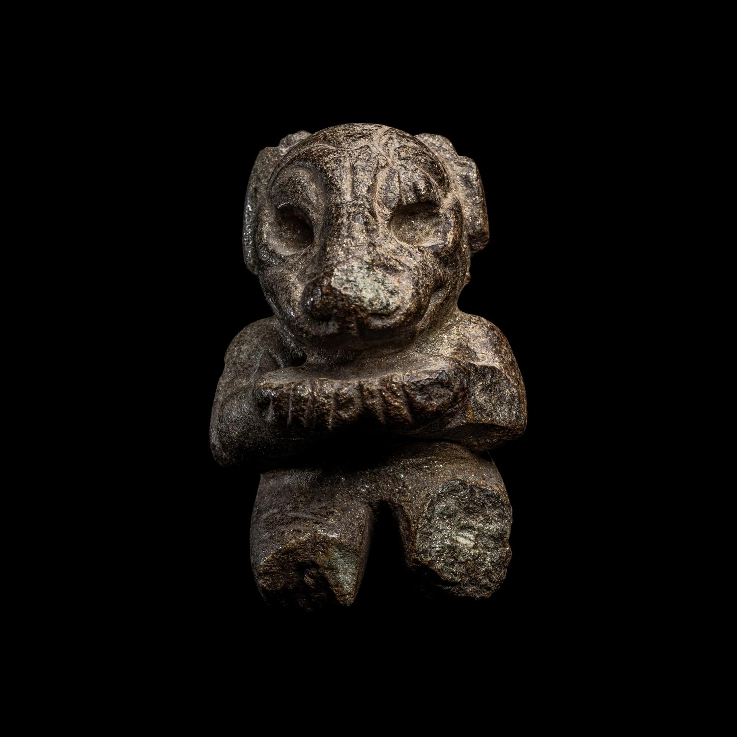 An Olmec Serpentine Kneeling Transformation Figure