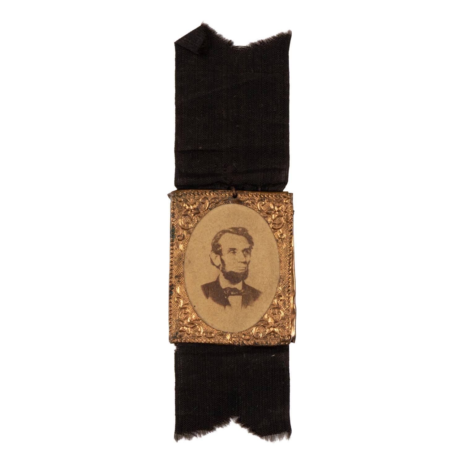 [LINCOLN FUNERAL]. A group of 4 mourning badges and 1 campaign badge, comprising: