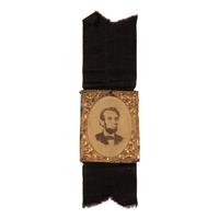 [LINCOLN FUNERAL]. A group of 4 mourning badges and 1 campaign badge, comprising: