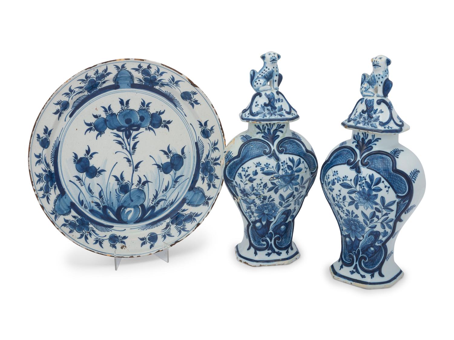 A Pair of Delft Earthenware Covered Vases and a Delft Charger