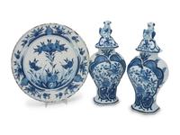 A Pair of Delft Earthenware Covered Vases and a Delft Charger