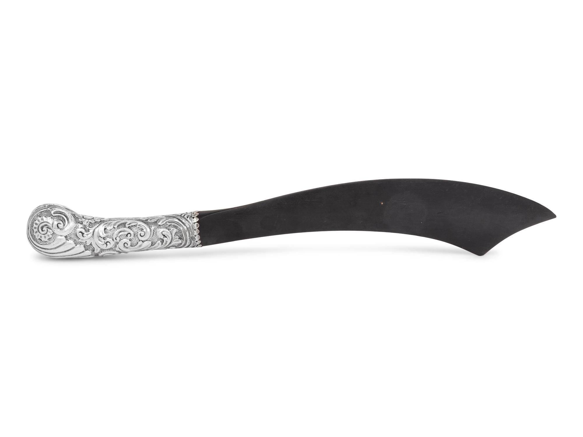 A Victorian Silver and Ebony Scimitar-Form Page Turner