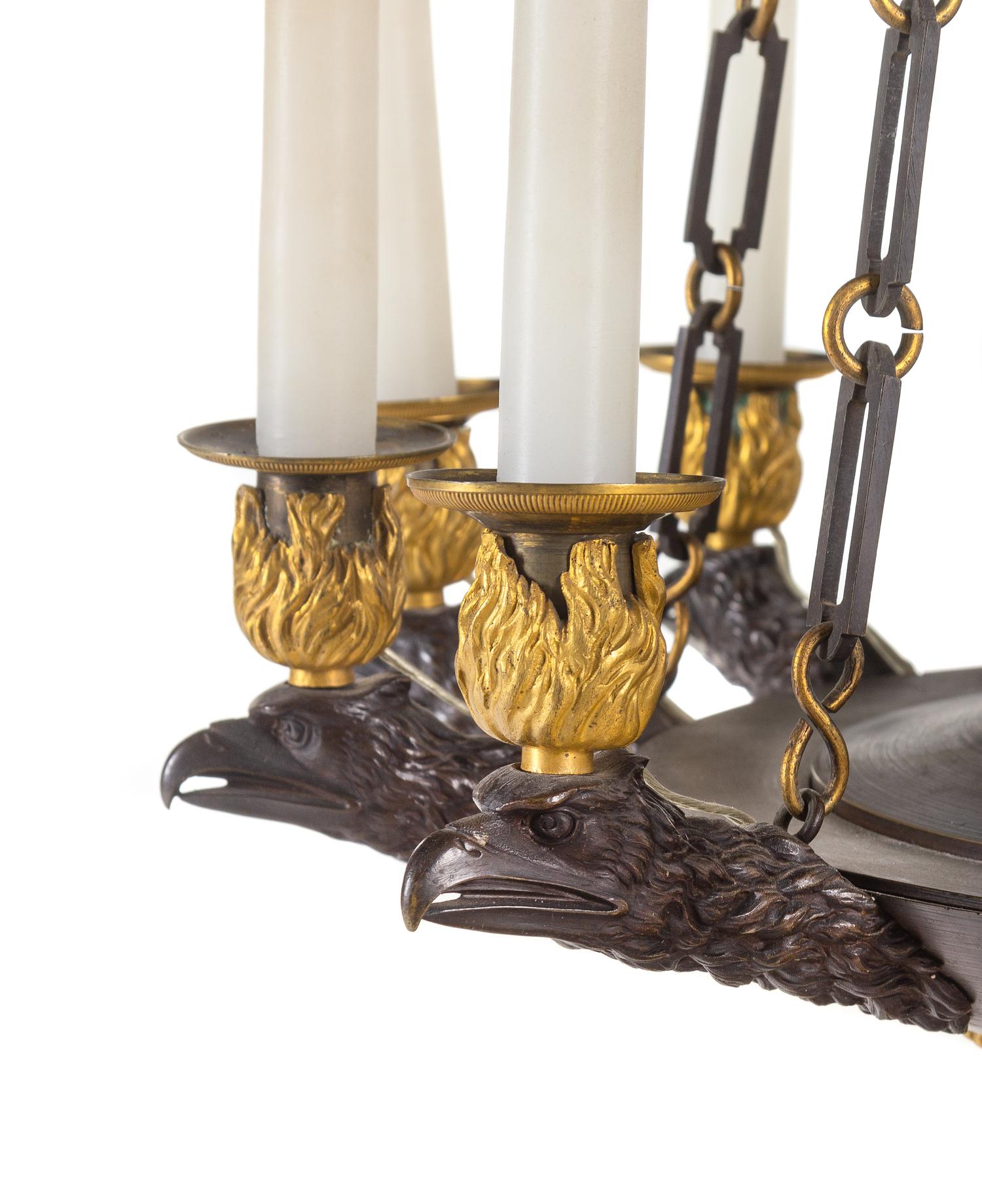 A Restauration Gilt and Patinated Bronze Twelve-Light Chandelier