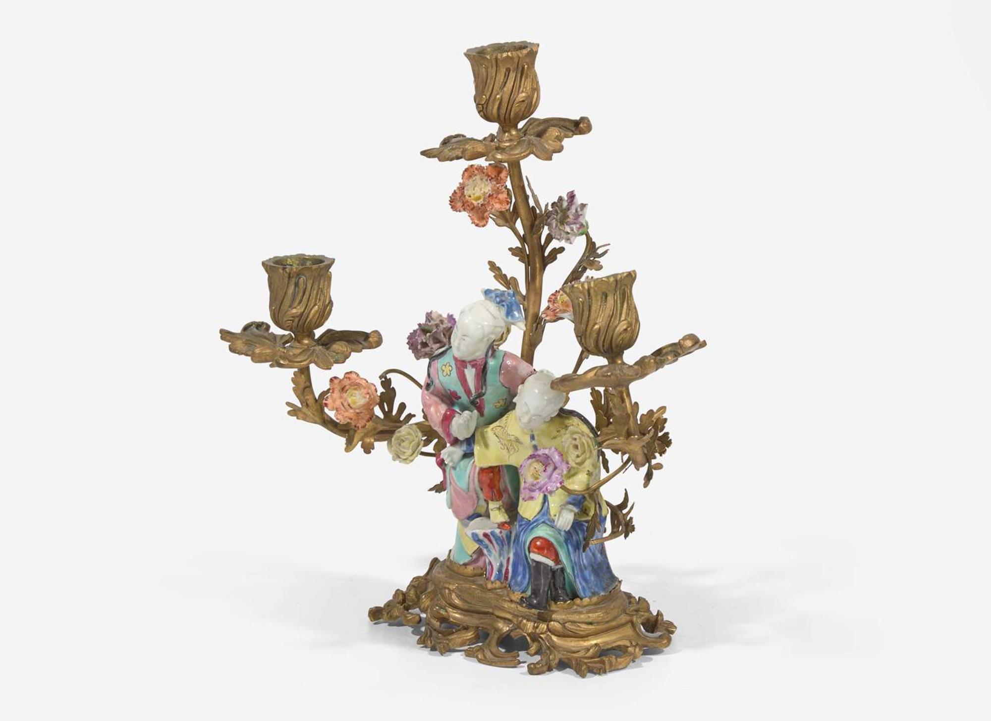 A gilt-bronze mounted Chinese figural porcelain three-light candelabra, the figure 18th century, the gilt bronze 19th century