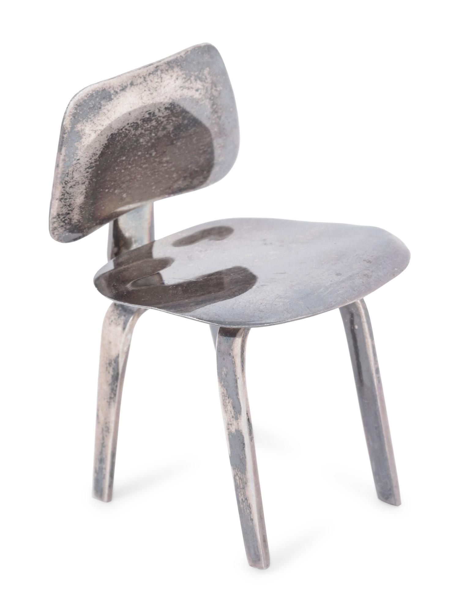 A Set of Three Silver Miniature Modernist Chairs