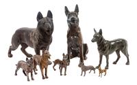 A Group of Eight Bronze and Metal German Shepherds Width of widest 12 inches.