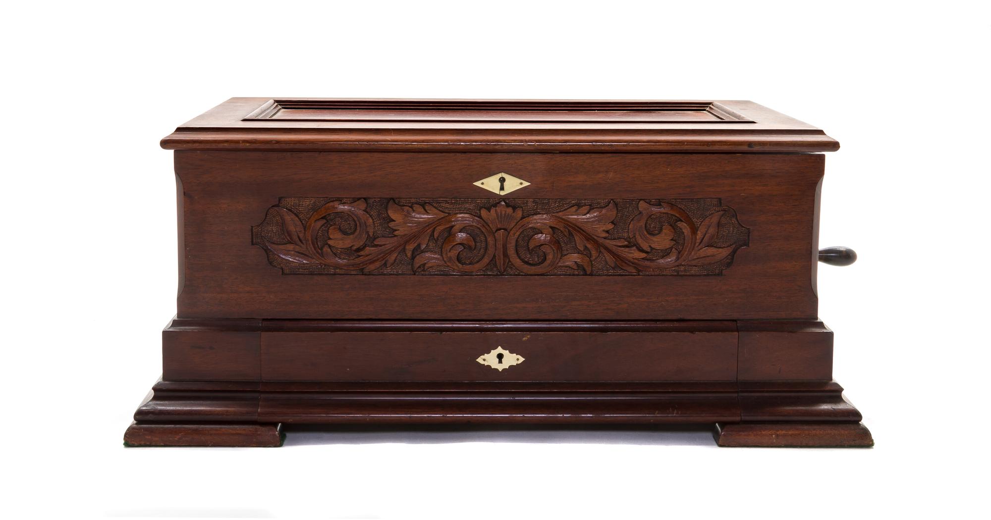 A Peerless Forte-Piccolo Mahogany Cylinder Music Box, Height 10 1/8 x width 25 1/4 x depth 14 1/4 inches.