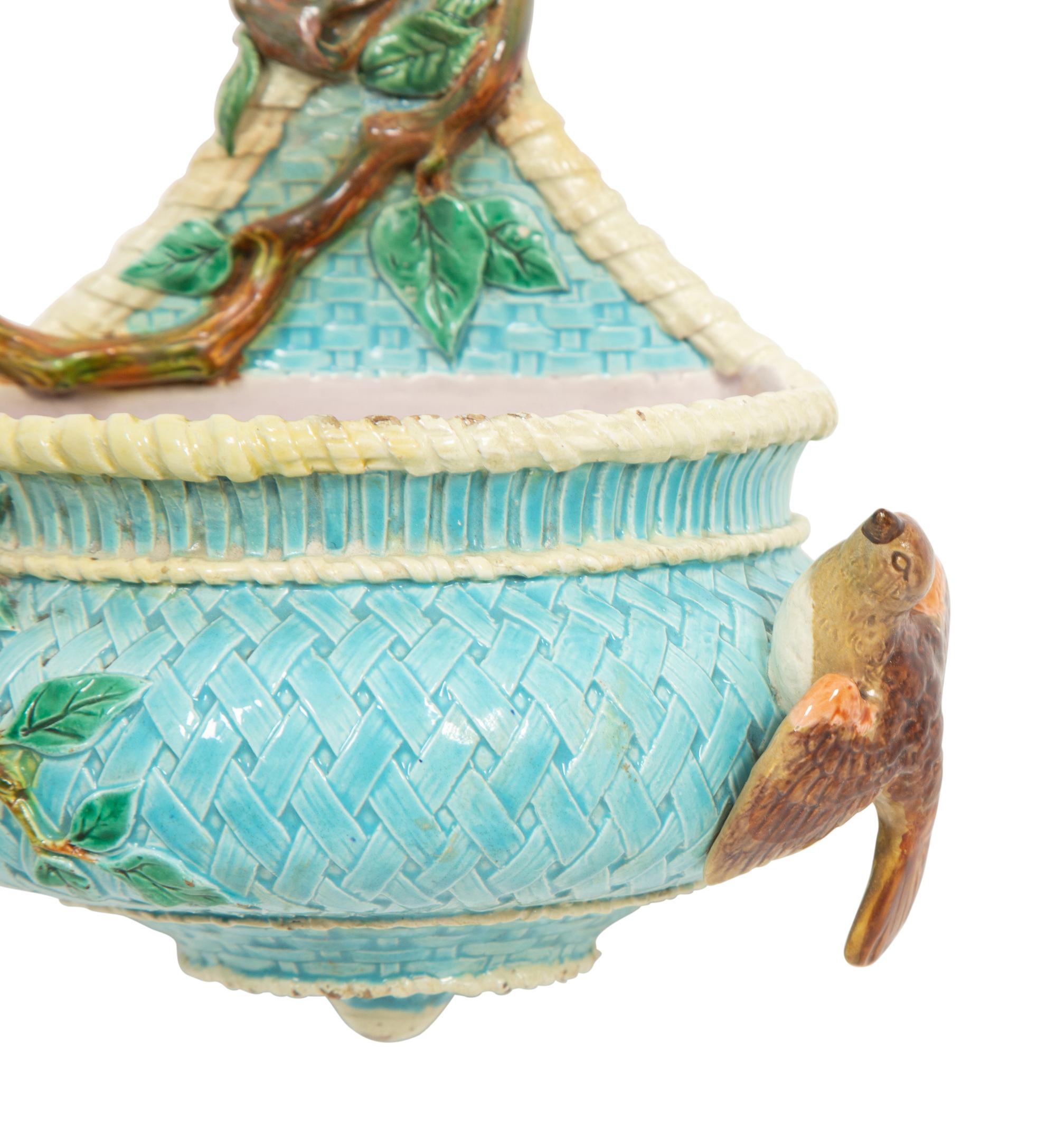 An English Majolica Jardiniere with Stand and a Cistern-form Wall Pocket