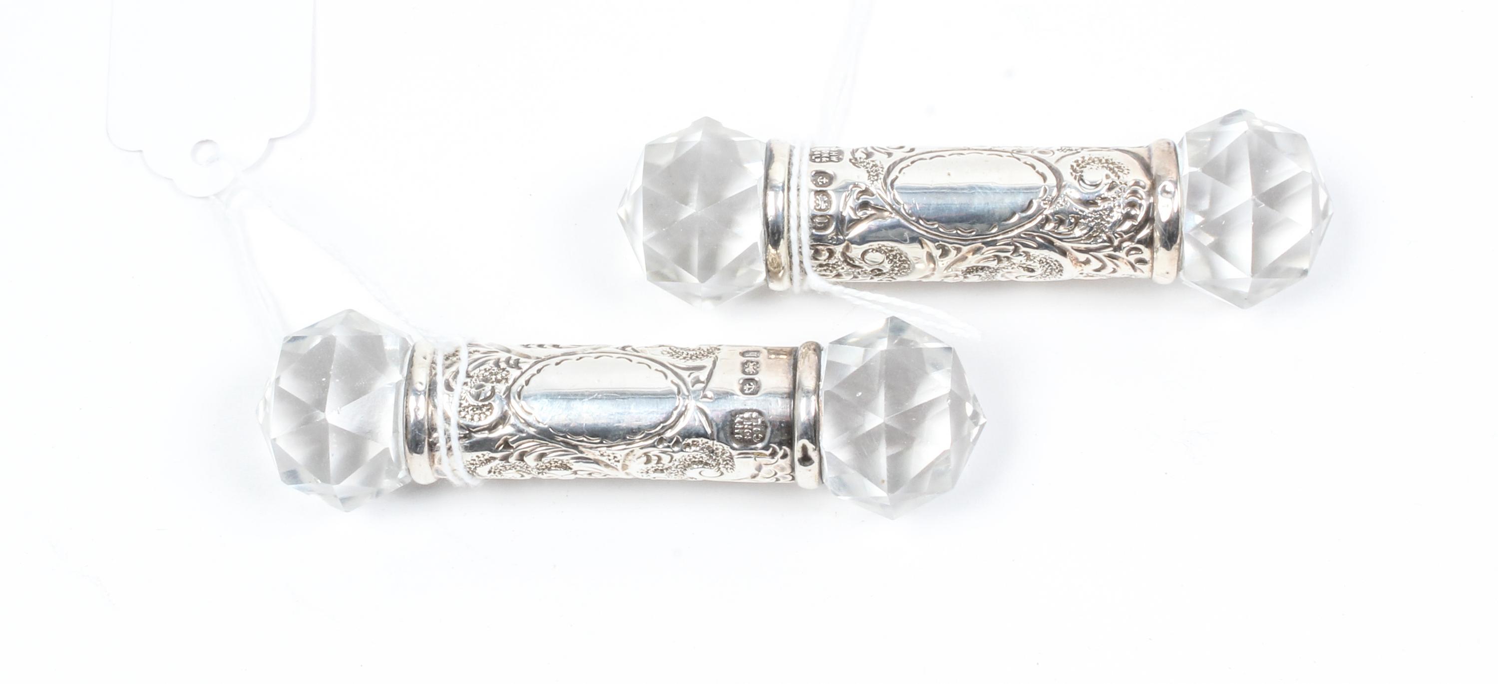 A Pair of Edwardian Silver and Cut Glass Knife Rests, J. B. Chatterley & Sons Ltd., Birmingham, 1907, the poles decorated with cut glas