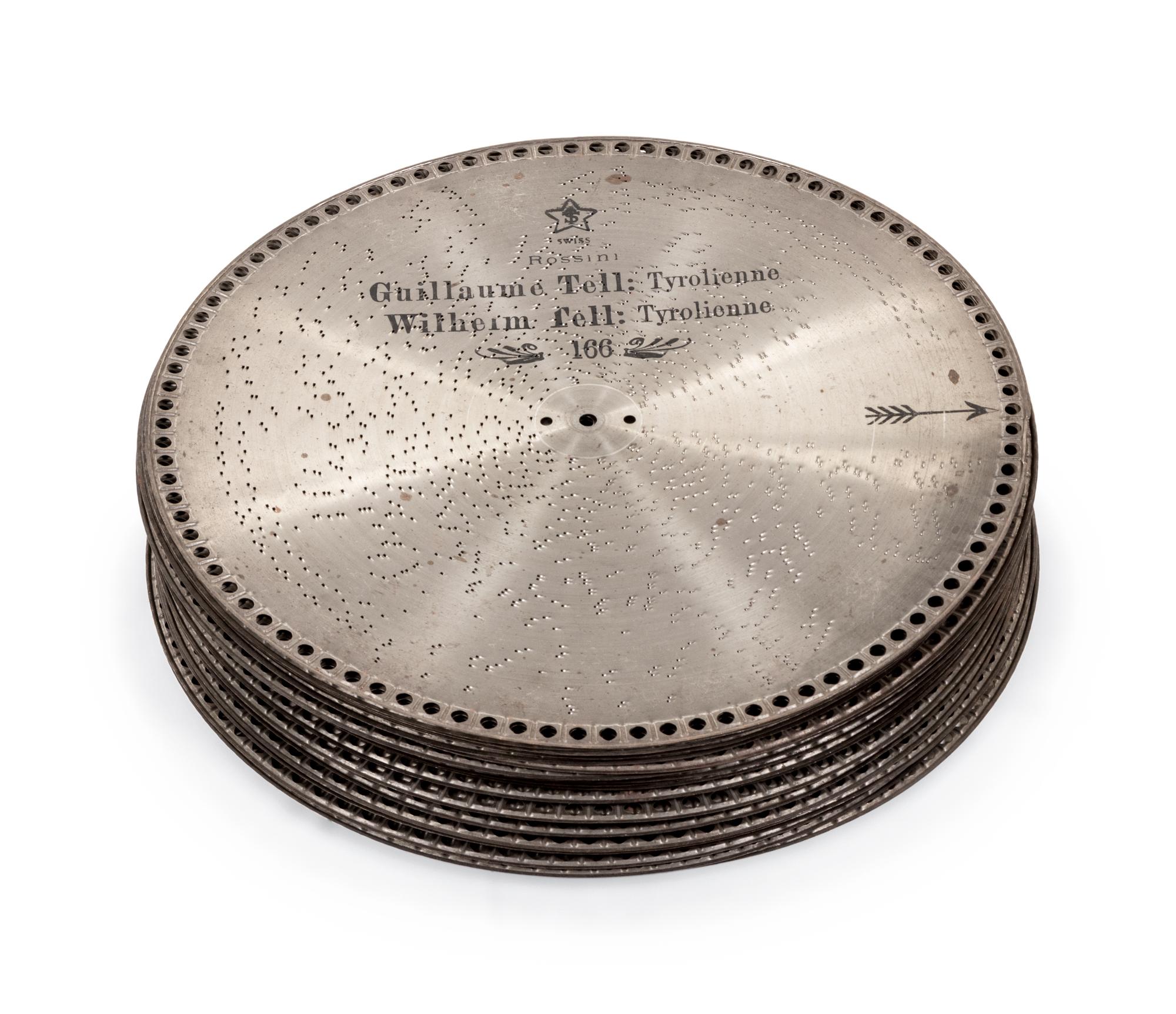 A Mira Double-Comb Disk Music Box with an Associated Table Stand and 30 Disks