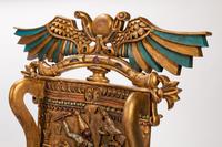 A Pair of Egyptian Revival Style Parcel-Gilt and Polychromed Throne Chairs