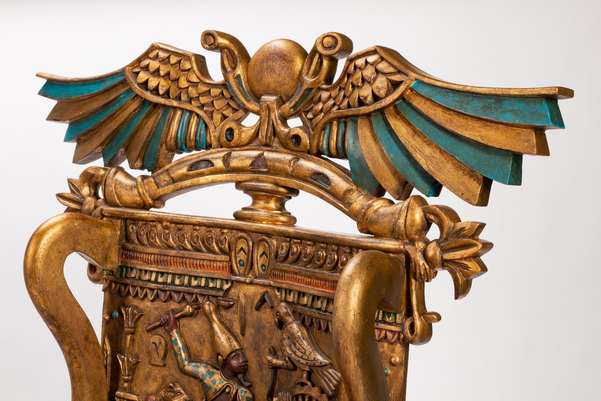A Pair of Egyptian Revival Style Parcel-Gilt and Polychromed Throne Chairs
