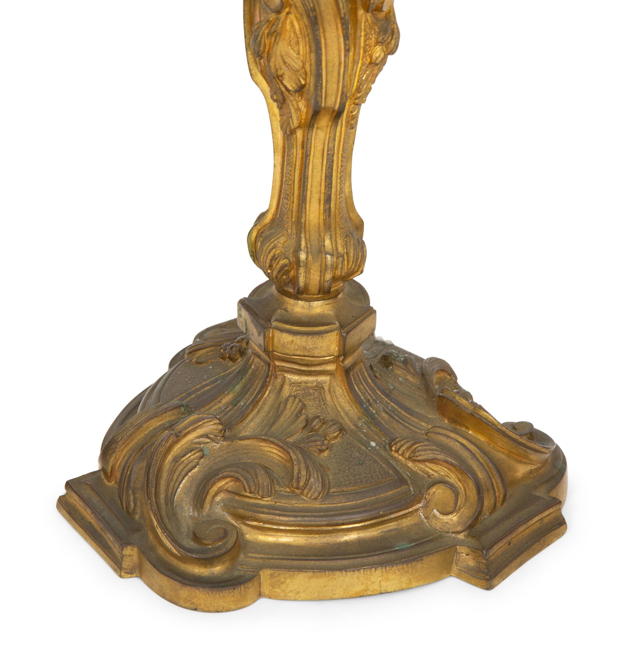 Two Pairs of Louis XV Style Gilt Bronze Candlesticks