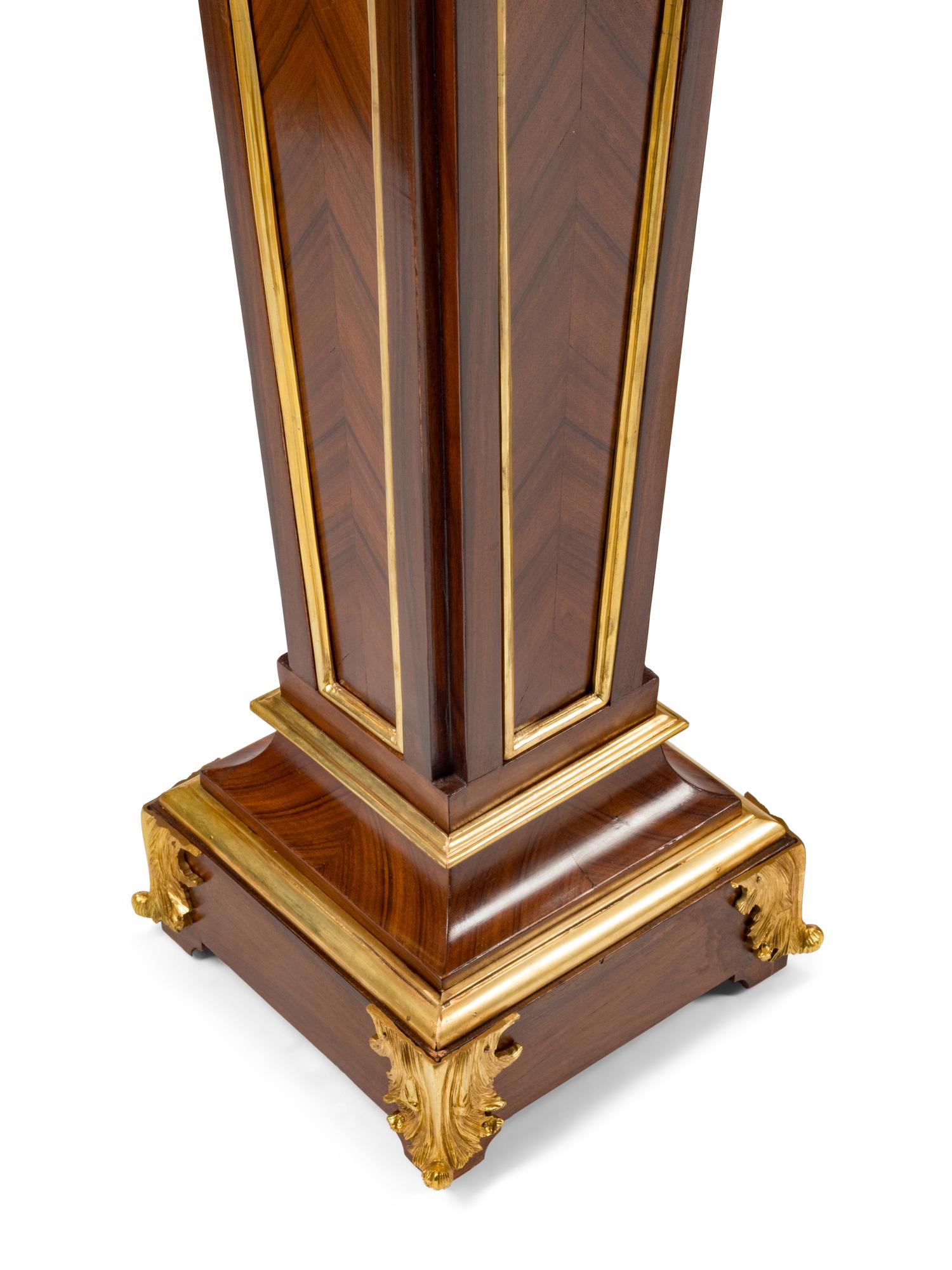 A Pair of Régence Style Gilt Bronze Mounted Bookmatch-Veneered Pedestals