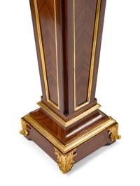 A Pair of Régence Style Gilt Bronze Mounted Bookmatch-Veneered Pedestals