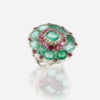 A green beryl, ruby, and ten karat white gold ring