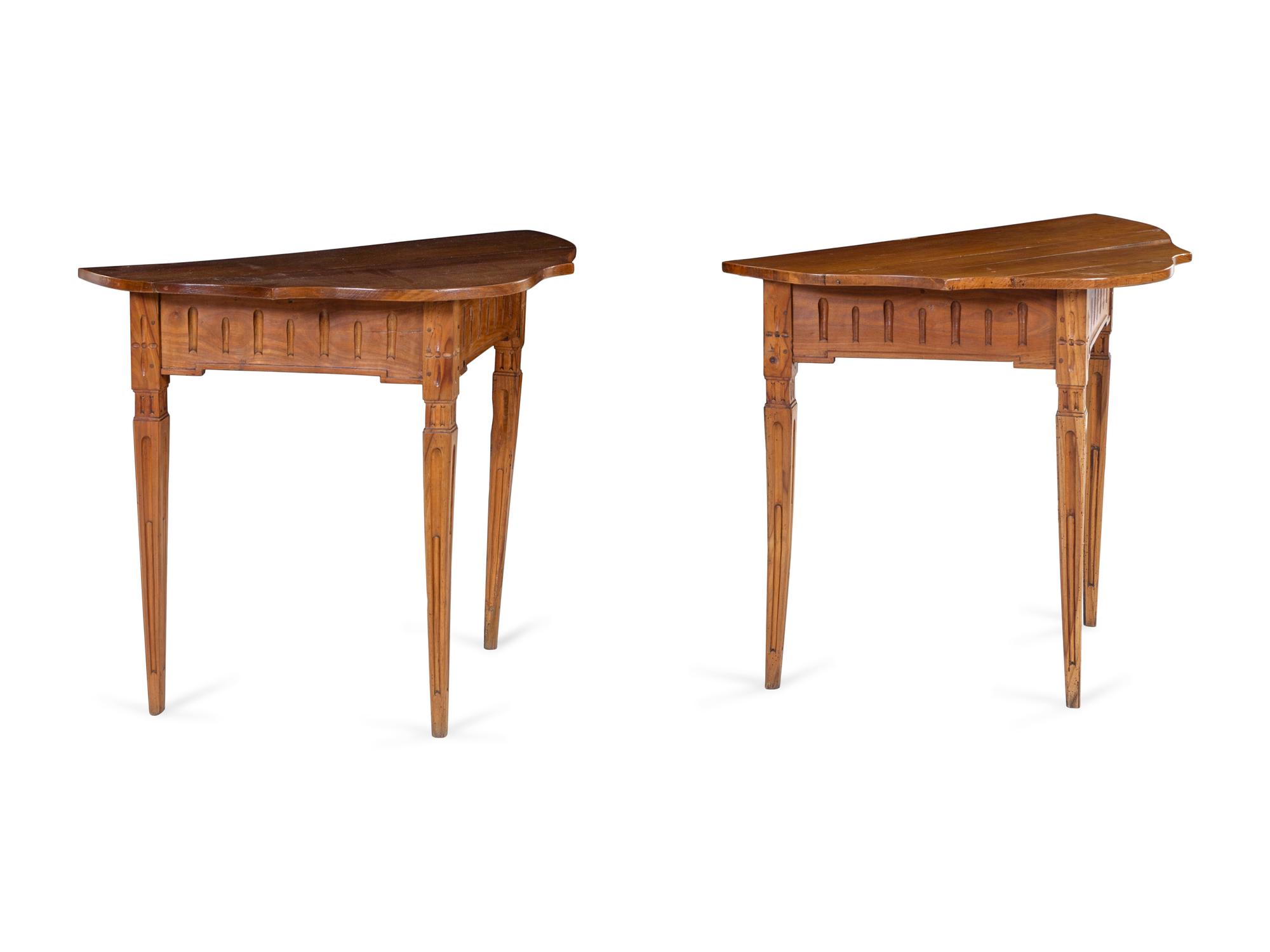 A Pair of Continental Carved Fruitwood Console Tables