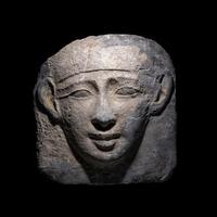 An Egyptian Limestone Mask from an Anthropoid Sarcophagus