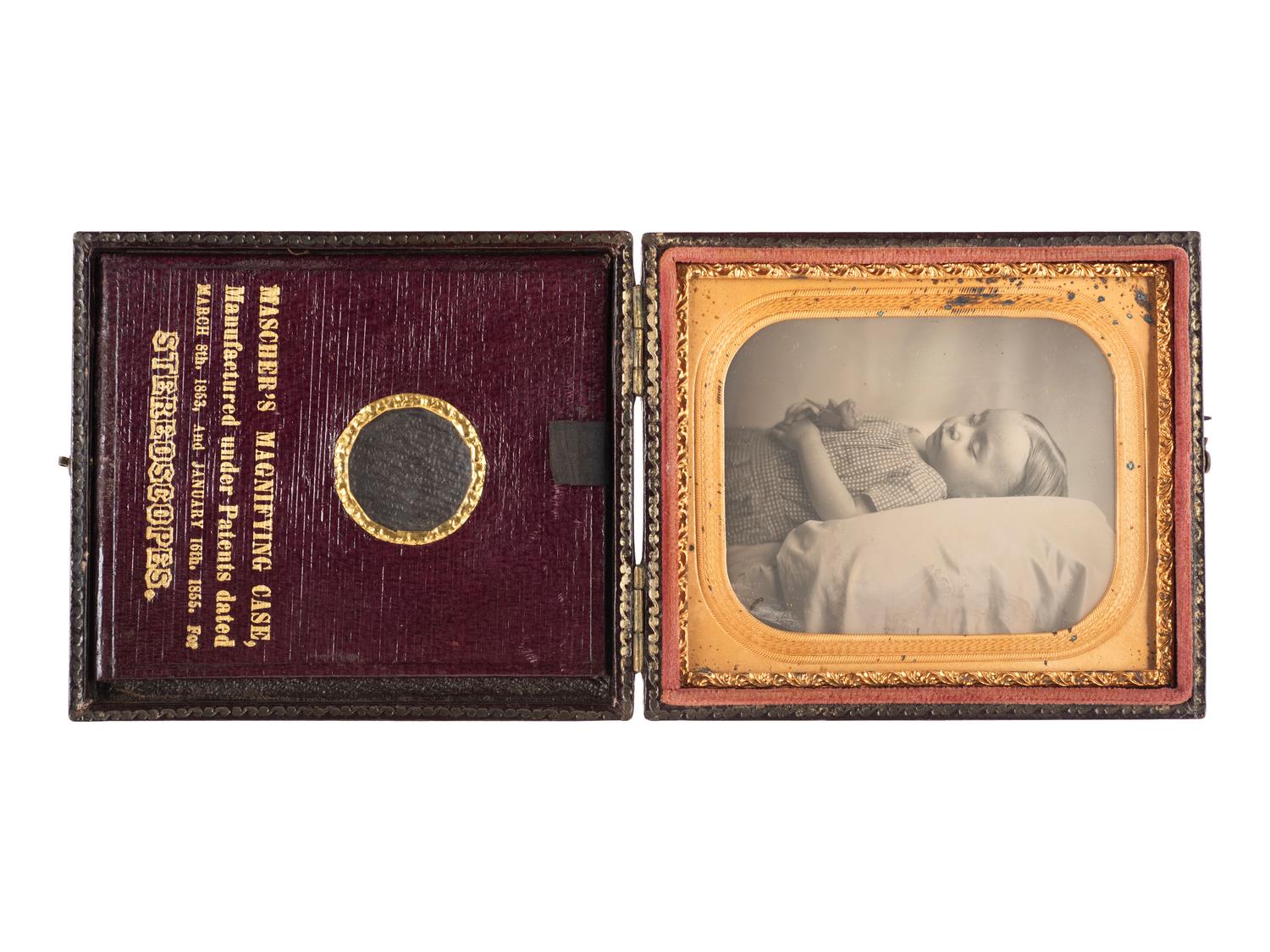 [EARLY PHOTOGRAPHY]. Sixth plate postmortem daguerreotype of a young child housed in a Mascher Magnifying Case.