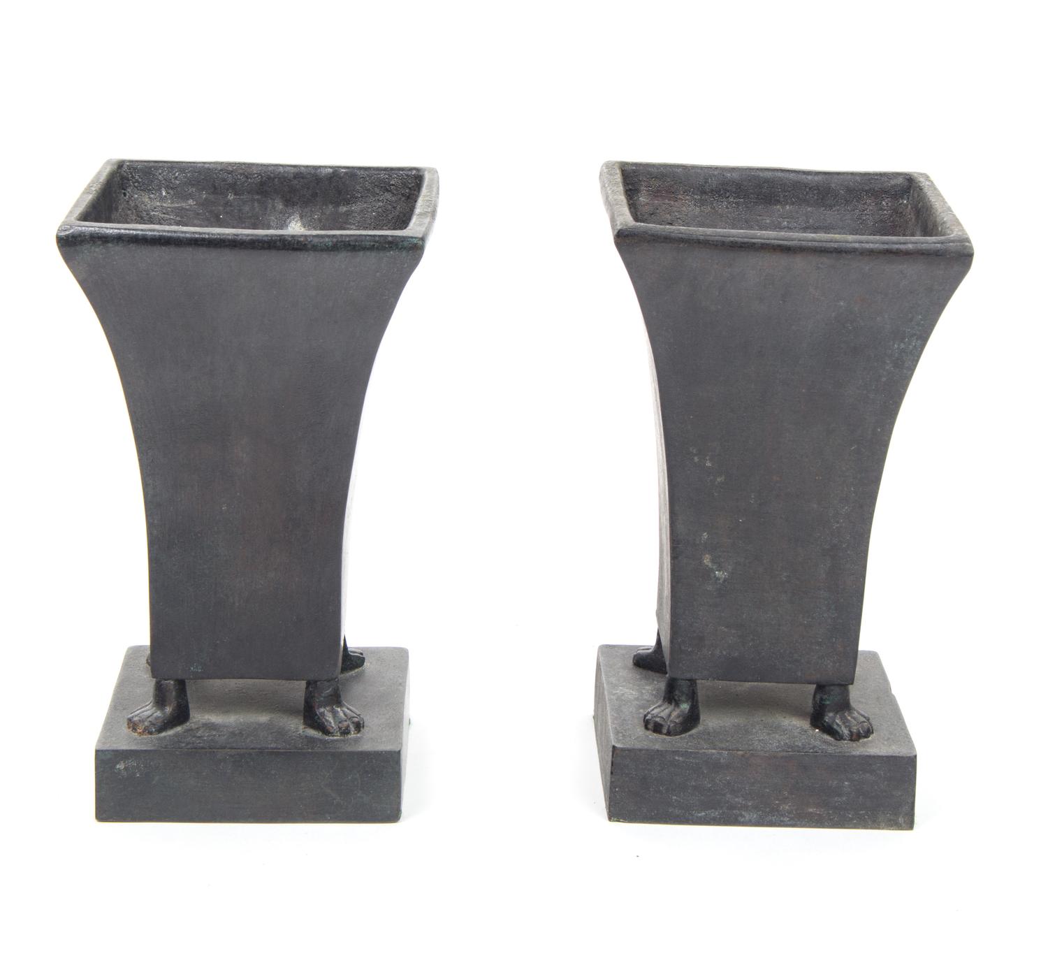 A Pair of Bronze Footed Urns Height 9 1/2 inches each.