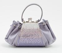 A Judith Leiber Purple Satin and Crystal Handbag, 8" x 4" x 3".