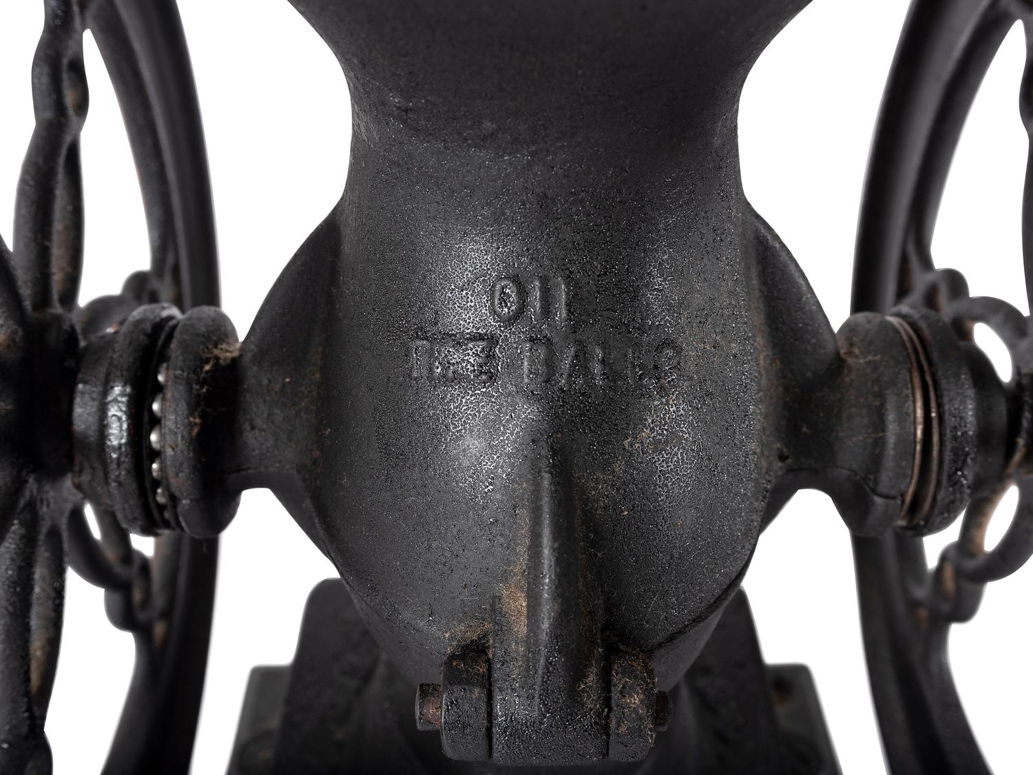 A Landers, Frary & Clark Cast Iron Coffee Mill with an Eagle Finial