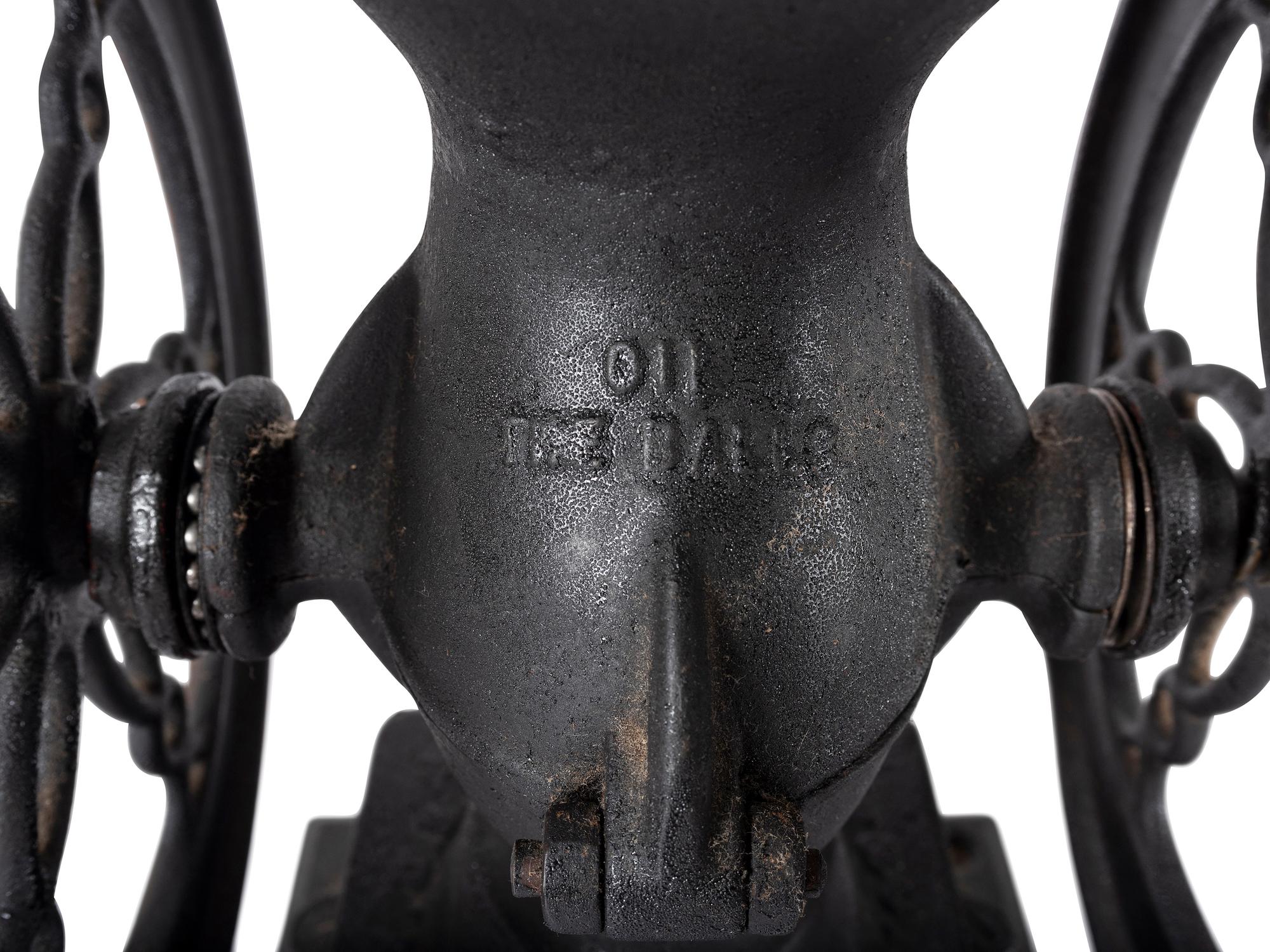 A Landers, Frary & Clark Cast Iron Coffee Mill with an Eagle Finial