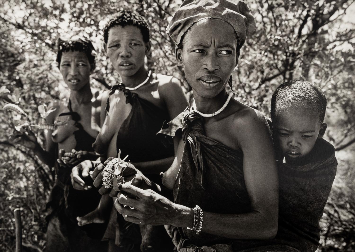 Sebastião Salgado (born 1944) Bushmen women collecting caterpillars in the Kalahari Desert. Botswana, Africa, 2008