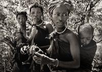 Sebastião Salgado (born 1944) Bushmen women collecting caterpillars in the Kalahari Desert. Botswana, Africa, 2008