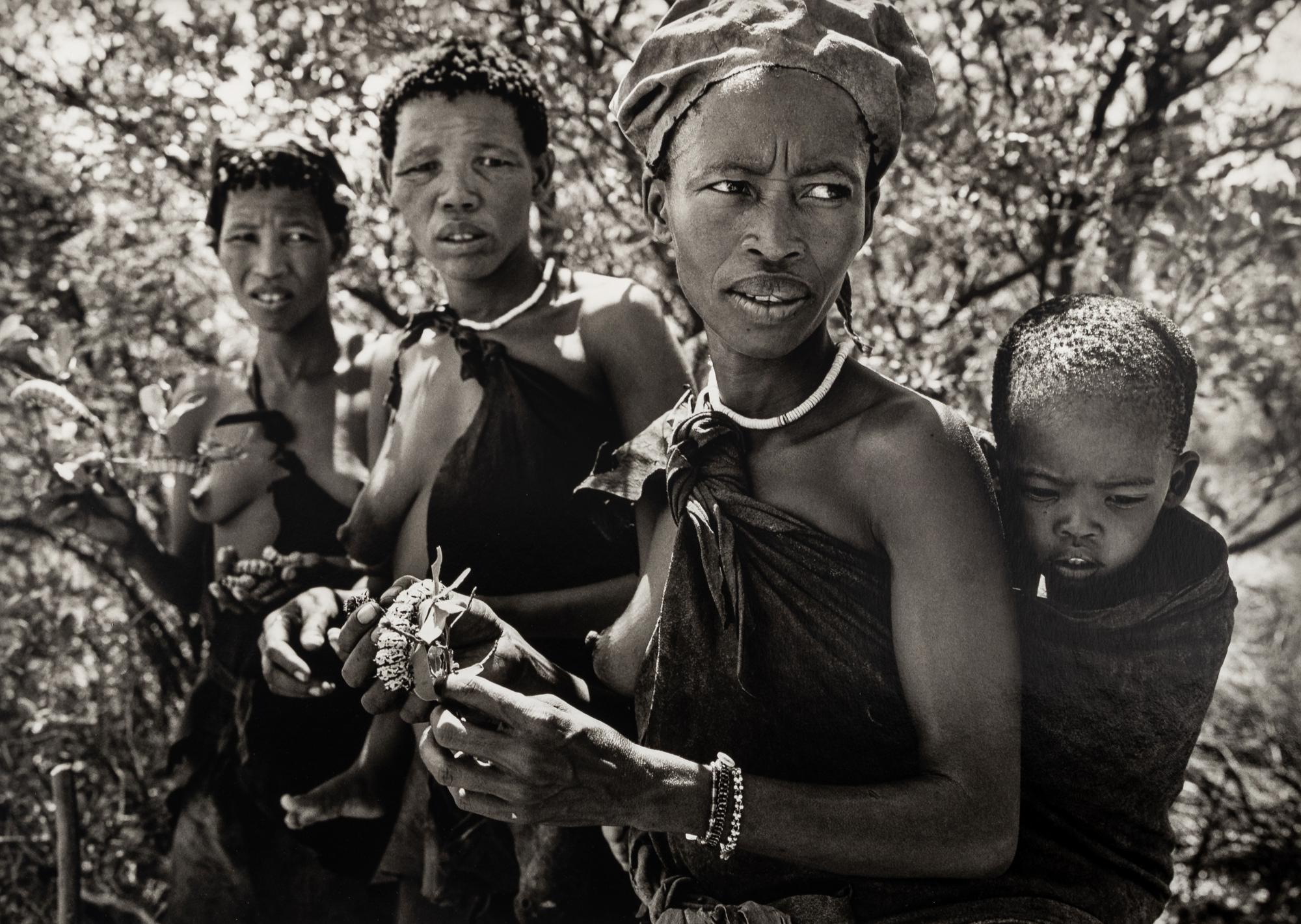 Sebastião Salgado (born 1944) Bushmen women collecting caterpillars in the Kalahari Desert. Botswana, Africa, 2008