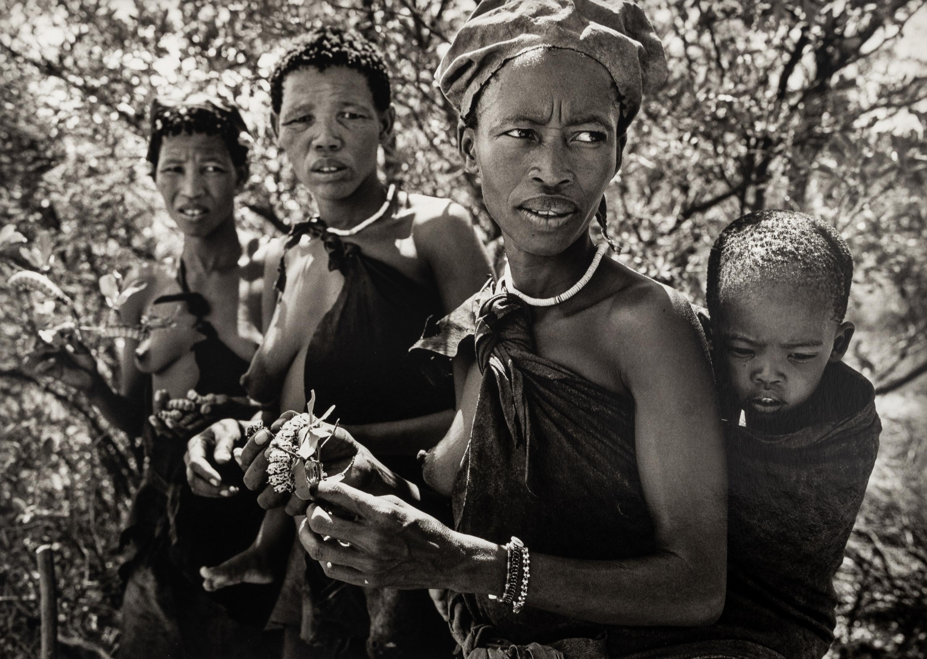 Sebastião Salgado (born 1944) Bushmen women collecting caterpillars in the Kalahari Desert. Botswana, Africa, 2008