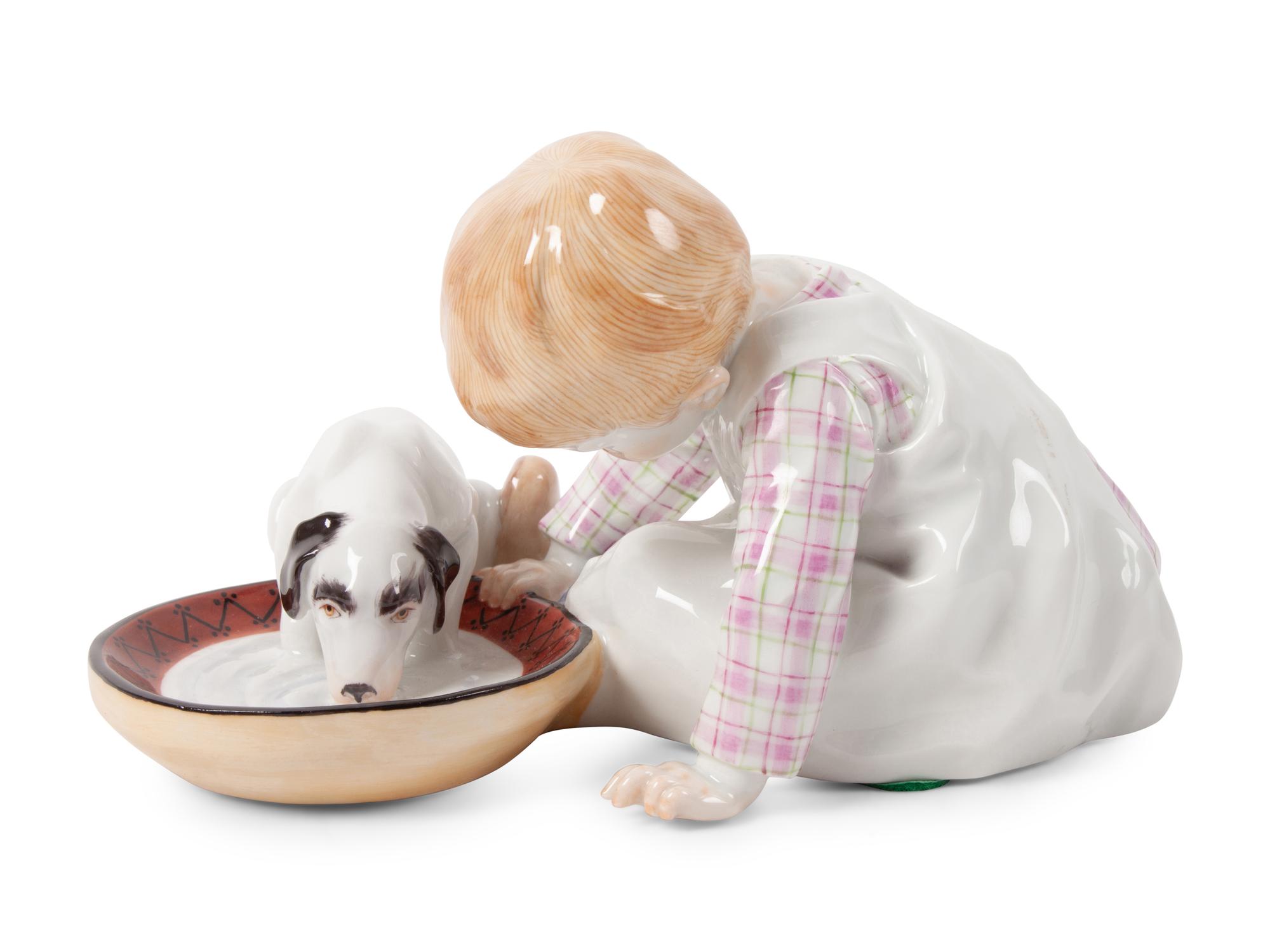 A Meissen Porcelain Figural Group of a Child Feeding Dog, by Konrad Hentschel