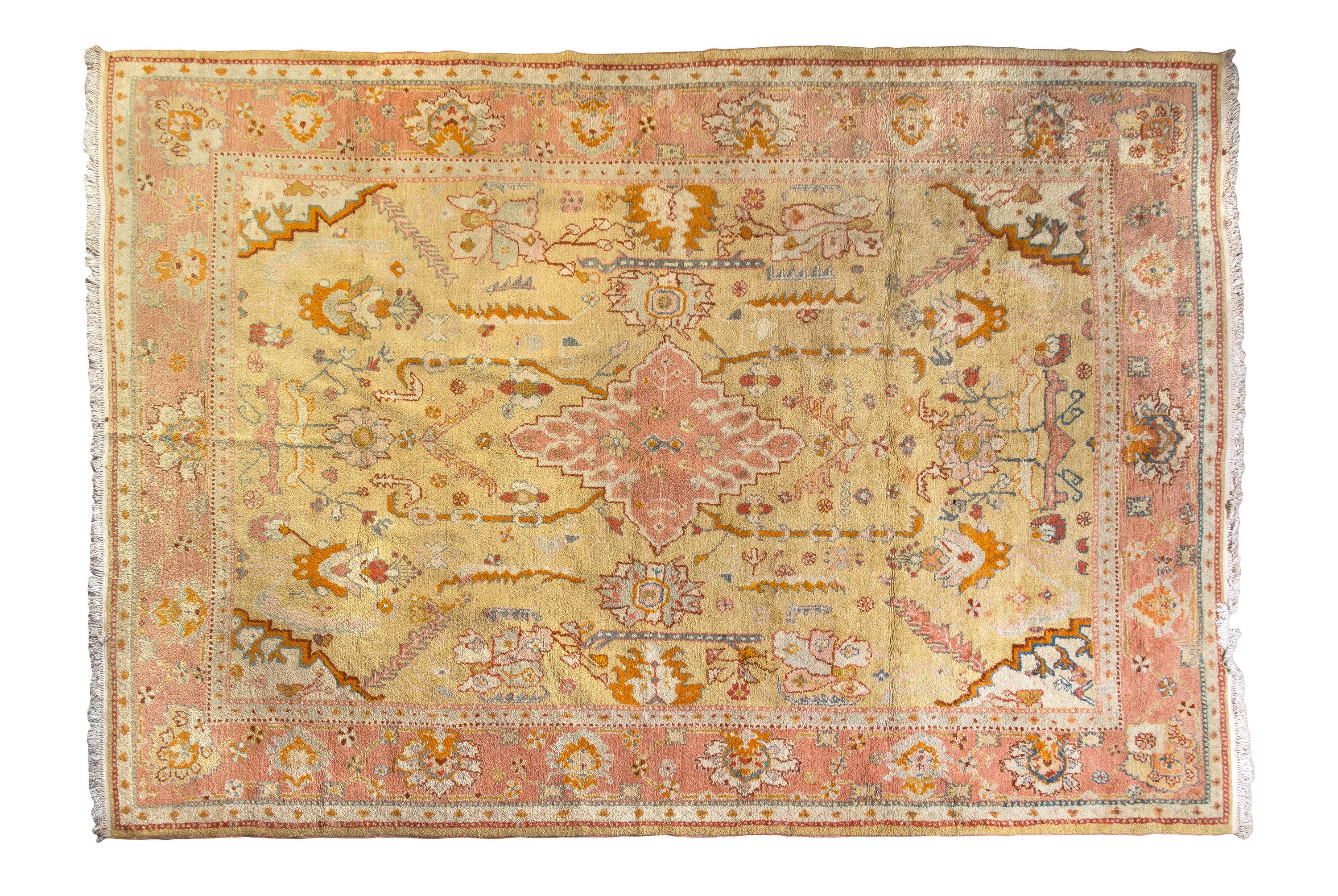 An Oushak or Heriz Wool Rug, MID-20TH CENTURY, 17 feet x 11 feet 8 inches. — MID-20TH CENTURY
