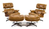 A Pair of Charles and Ray Eames for Herman Miller Leather Upholstered Lounge Chairs and Ottomans Height of chairs 33 inches.