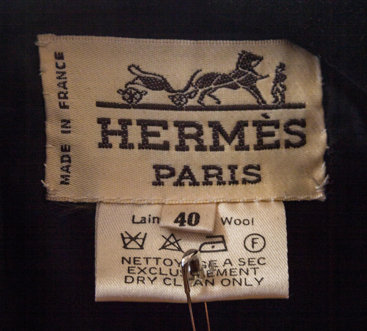 An Hermes Black Wool Skirt Suit, Size 40.