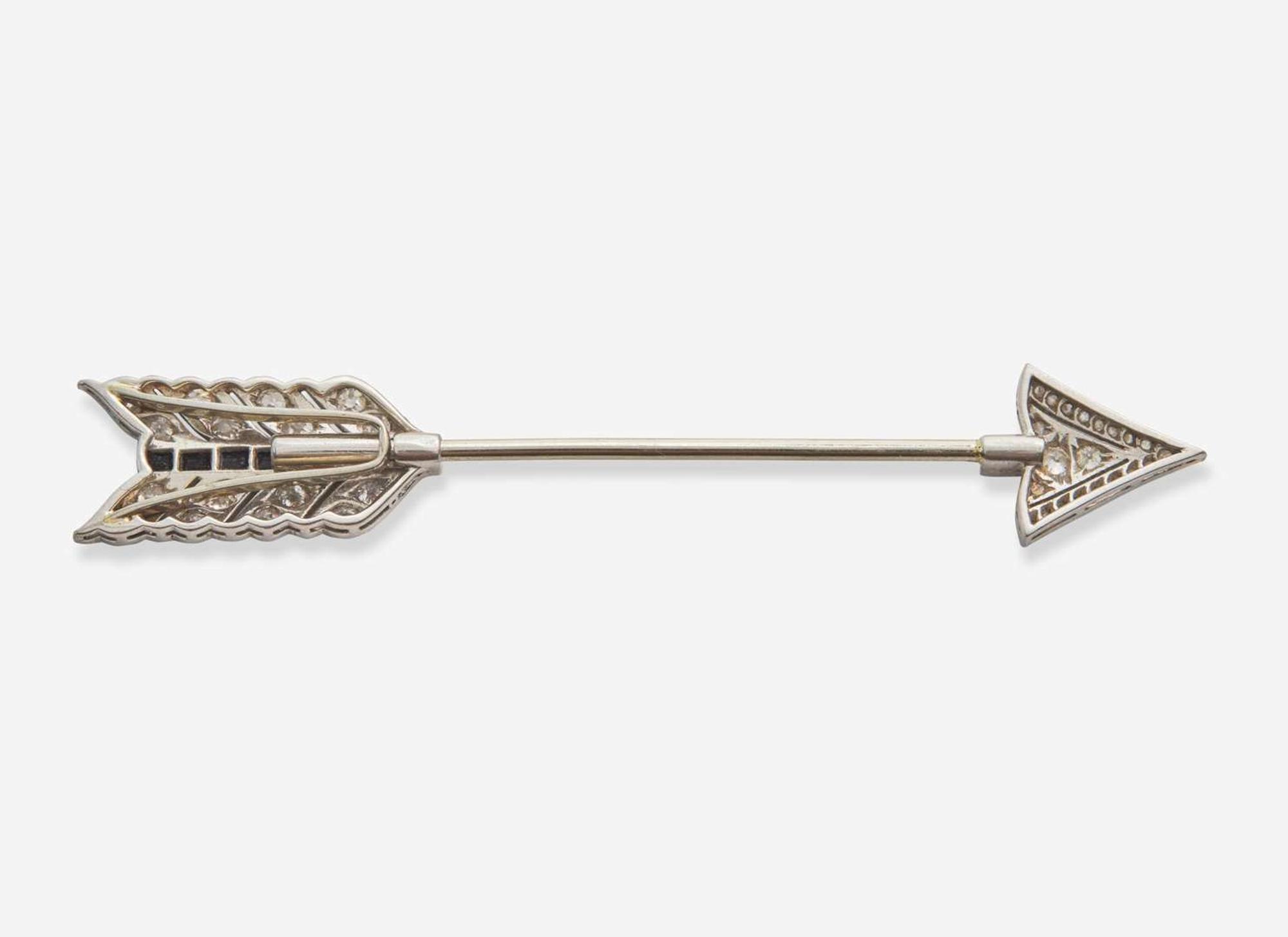 A Platinum, Diamond, and Onyx Jabot Brooch