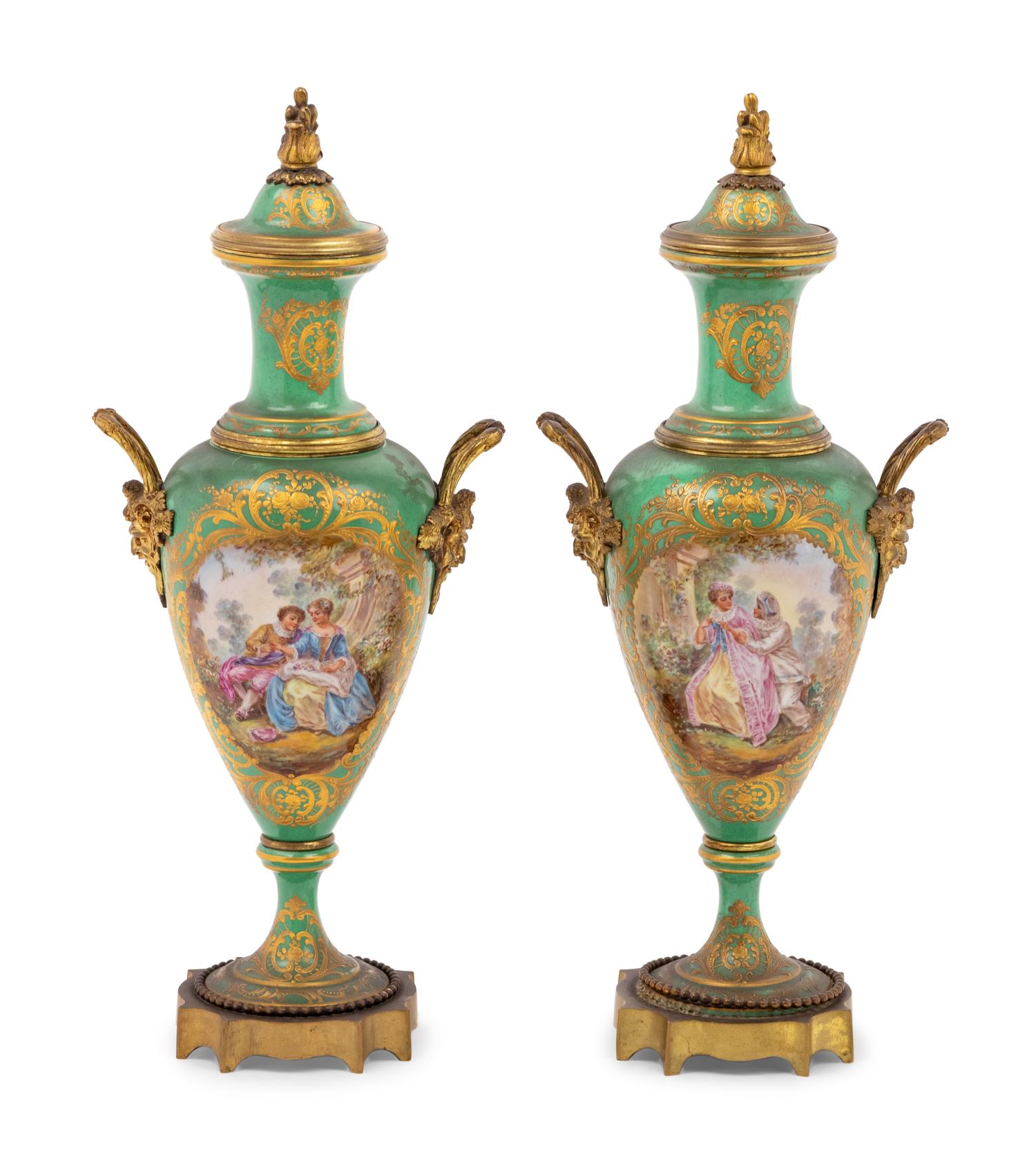 A Pair of Sèvres Style Gilt Metal Mounted Porcelain Urns