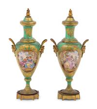 A Pair of Sèvres Style Gilt Metal Mounted Porcelain Urns