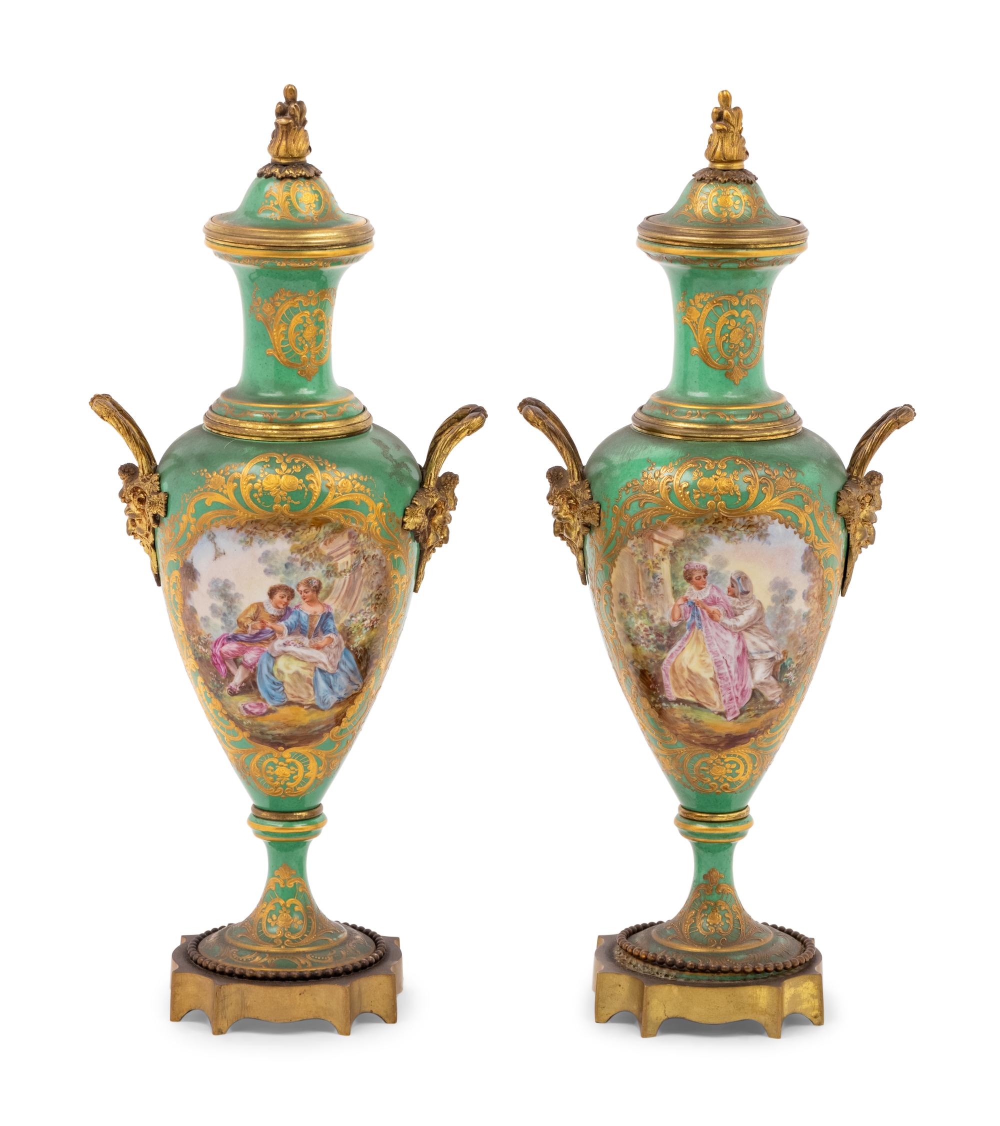 A Pair of Sèvres Style Gilt Metal Mounted Porcelain Urns